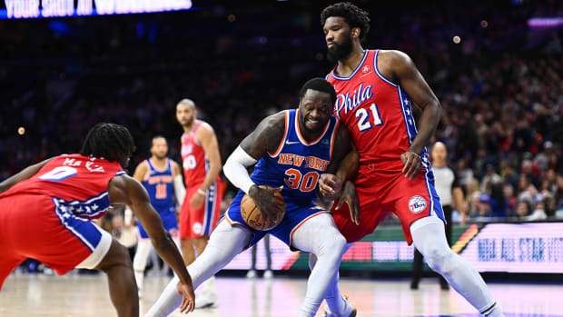 New York Knicks forward Julius Randle backs down Philadelphia 76ers center Joel Embiid